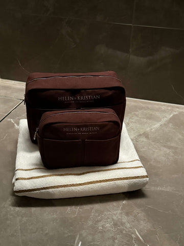 Dusky Plum Collection bags showcasing Scandinavian simplicity on a folded towel, emphasizing elegance and functionality.