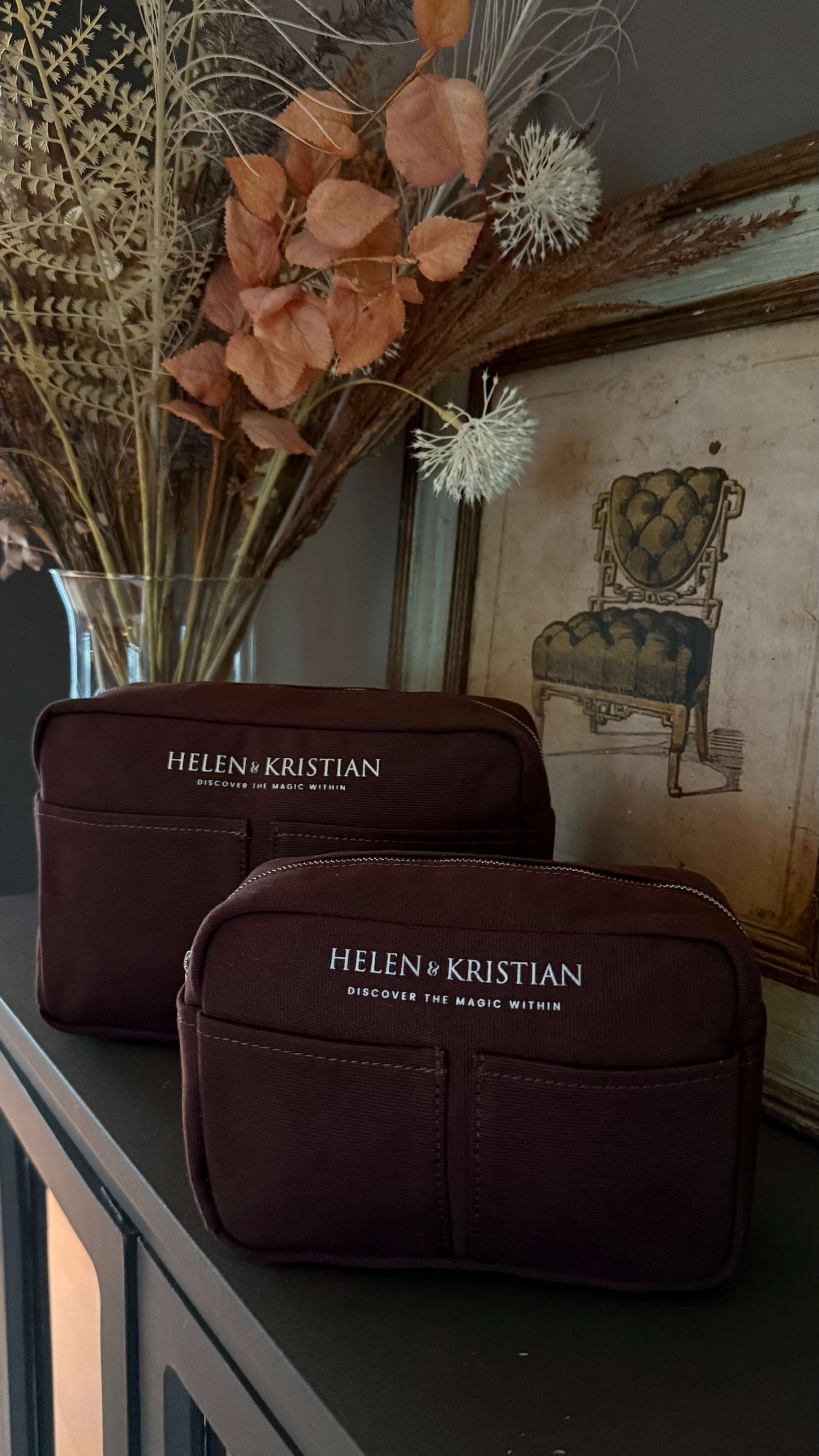 Nesty Roasted Chestnut petite trousse de toilette by Helen & Kristian displayed on a shelf with autumnal decor.