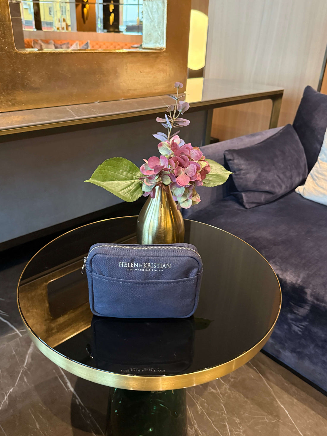 Nipsy - Clutch - Blueberry Mist displayed on a table with a stylish interior background.