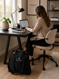 Organizer - Veske - Black Raven used on desk by a woman working on a laptop in a home office setting.