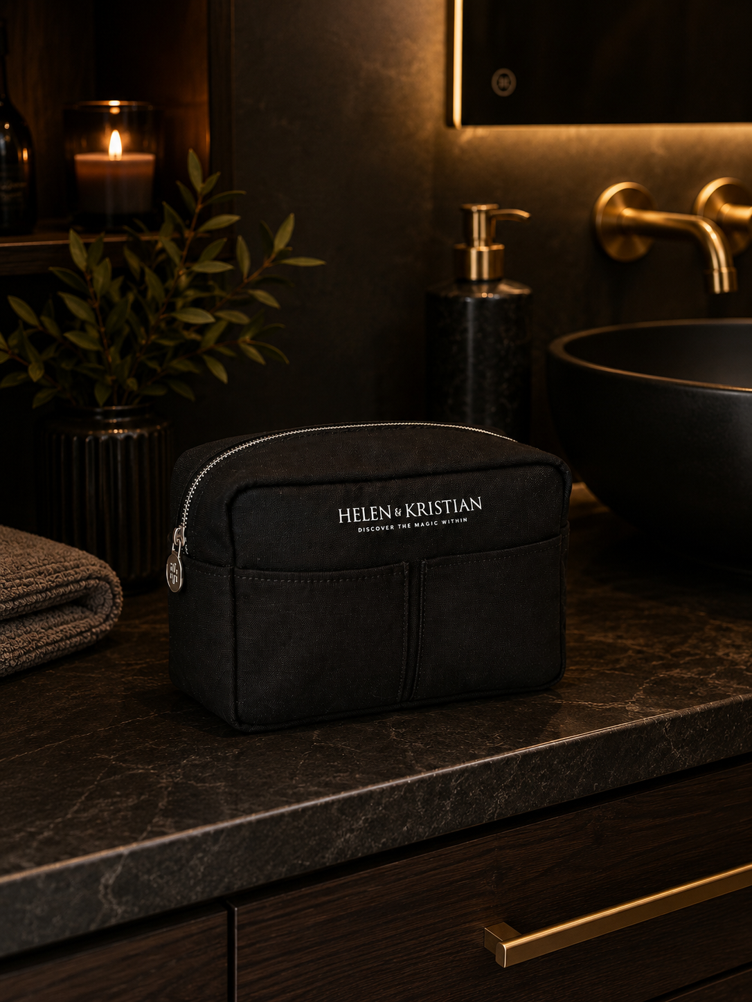 Nesty - Stor Toalettmappe - Black Raven on a marble bathroom countertop with candles and plant decor.