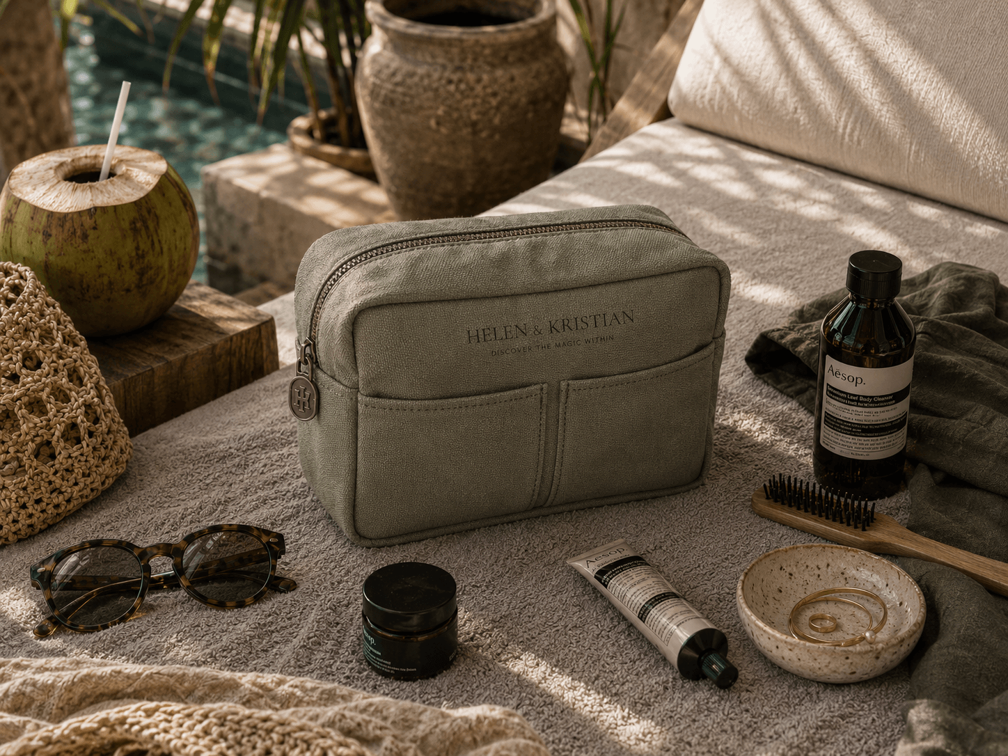 Nesty - Stor Toalettmappe - Deep Forest laying on a textured surface surrounded by beauty products and sunglasses.