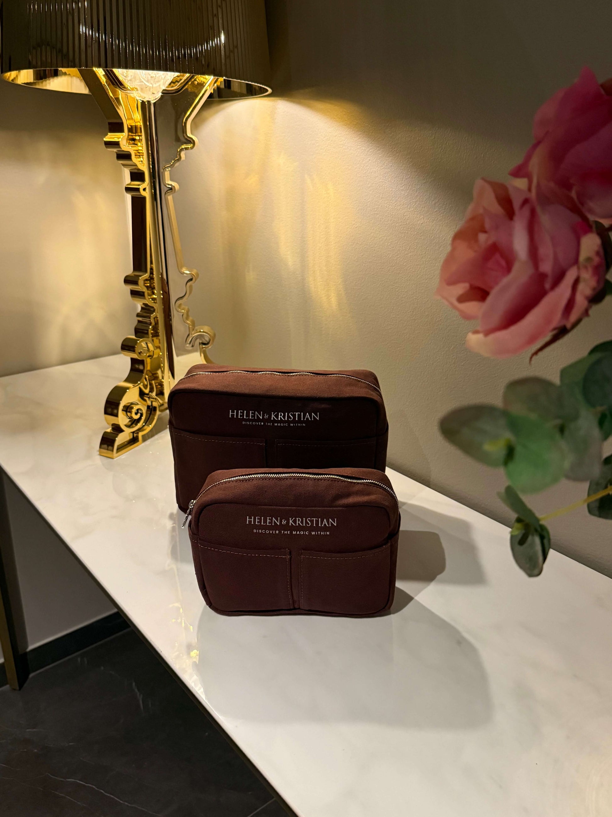 Nesty Roasted Chestnut petite trousse de toilette by Helen & Kristian on elegant display table