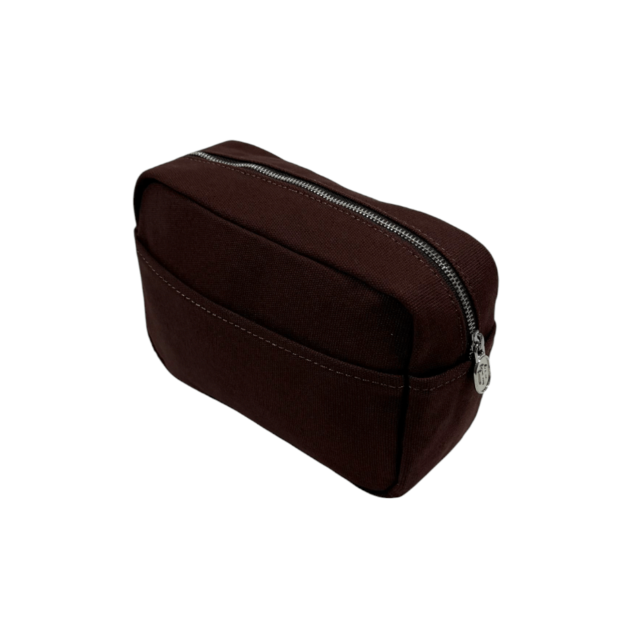 Brown toiletry bag from Helen & Kristian with a silver zipper on a white background