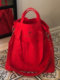 Red Aurora Flame organizer bag with Helen & Kristian logo